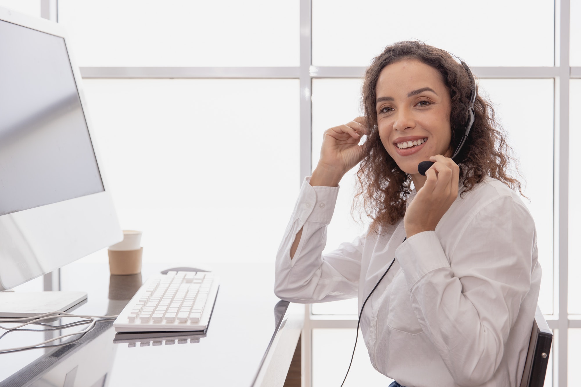 African American women hotline staff working in call center office for customer service assistant of