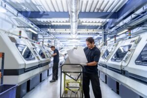 Workers in circuit board manufacturing factory